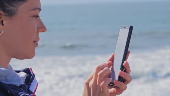 Woman Typing Chat Message on Cell Phone