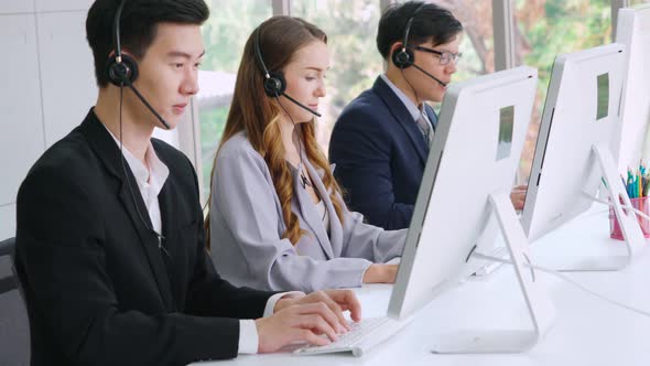 Business People Wearing Headset Working in Office