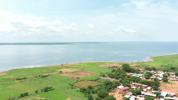 Beautiful shot of the river with community Africa under the cloudy skies