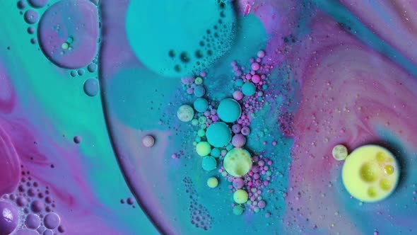 Abstract Acrylic Paint Spread Blast Explode Galaxy. Bright colored bubbles sparkling.