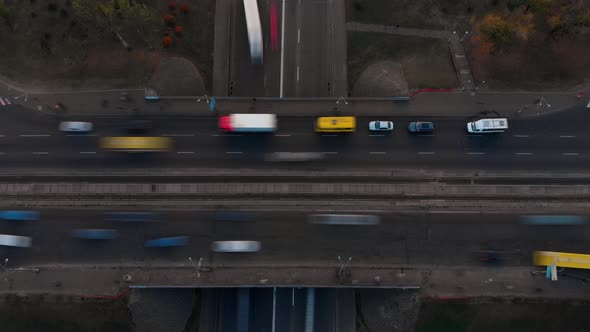 Aerial Timelapse of the Cars Passing By on a Highway and a Bridge