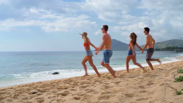 Couples running on the beach 