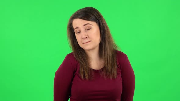 Portrait of Pretty Girl Is Smiling and Shrugging. Green Screen