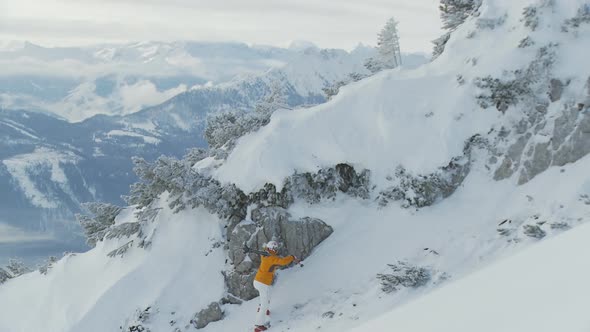 Skier Climbing up Mountain