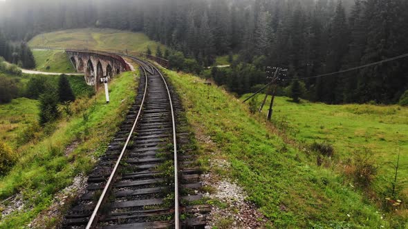 Railway in the Forest in Mountains
