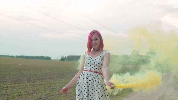 Carefree Woman Walking in Clouds of Smoke Outdoors