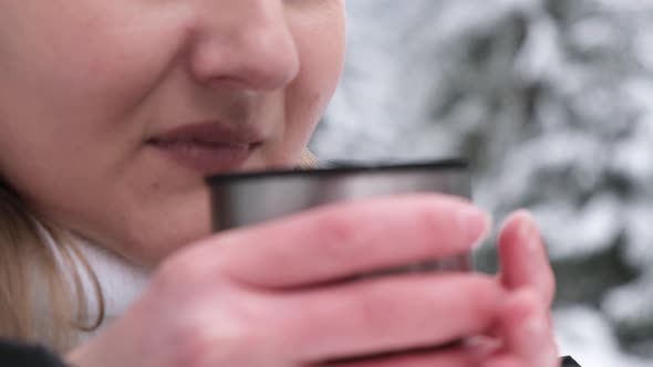 Girl Drinking Tea in the Winter Forest an Amazing Place with a Beautiful Snowcovered Forest