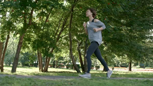 Healthy Woman Jogging in Park