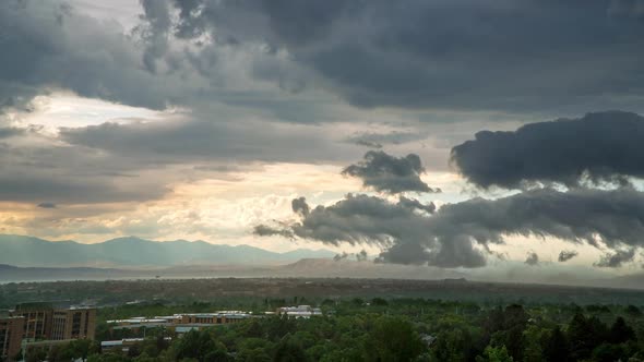 Time lapse overlooking Provo as storm blows dirt and clouds through the city