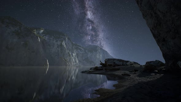 Hyperlapse of Night Starry Sky with Mountain and Ocean Beach in Lofoten Norway