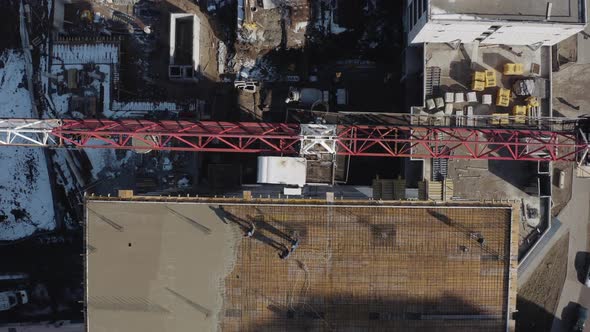 Vertical Shot From Above of a Crane on a Construction Site in Slow Motion in Kharkov, Ukraine. Tall