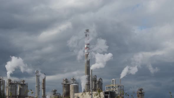 Industrial Chimneys Expelling Smoke