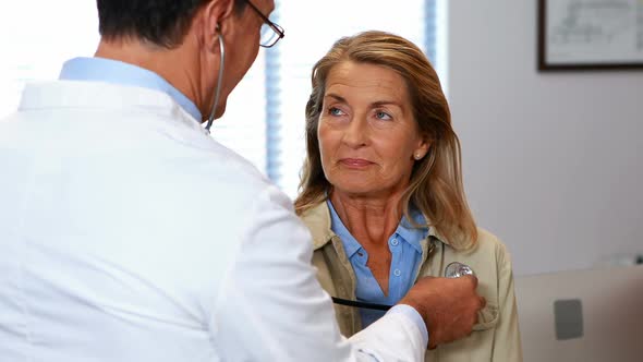 Doctor examining a senior woman