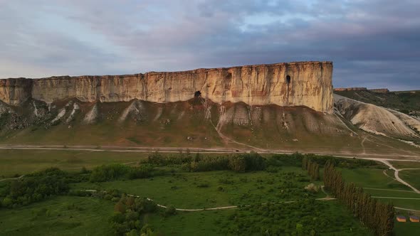 White Vertical Rocky Wall Rising Above the Valley