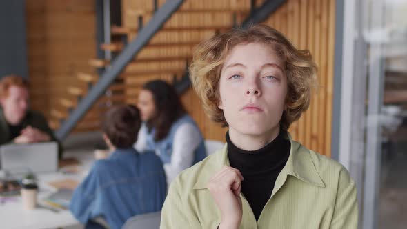 Portrait of Young Businesswoman Posing in Workplace