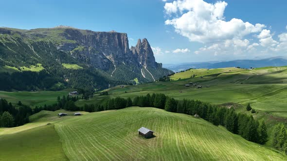 Dolomites Mountains with hiking paths and wooden cottages