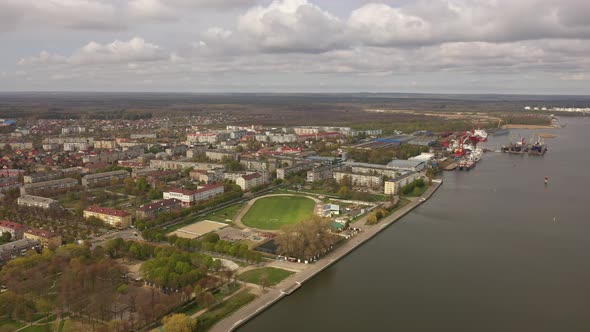 Aerial view of the stadium near port in Svetliy town