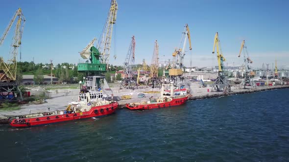 Small Boats And  Cranes In Port