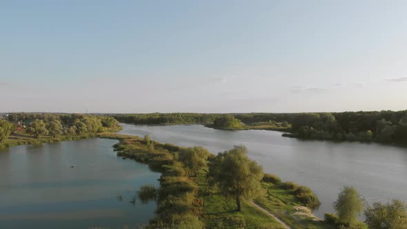 Flight Over the River and Forest at Summer Time