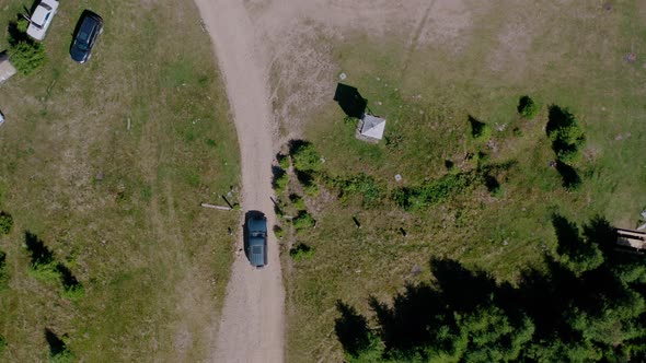 Aerial Drone View, the Car Passes By the Bullet Old Radar Station Pamir in Shape of White Spheres in