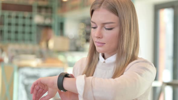 Portrait of Smart Watch Use By Young Woman 