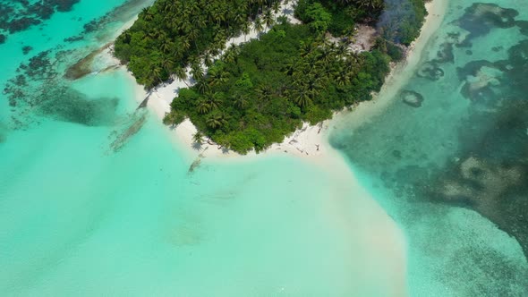 Natural above clean view of a white sand paradise beach and turquoise sea background in high resolut