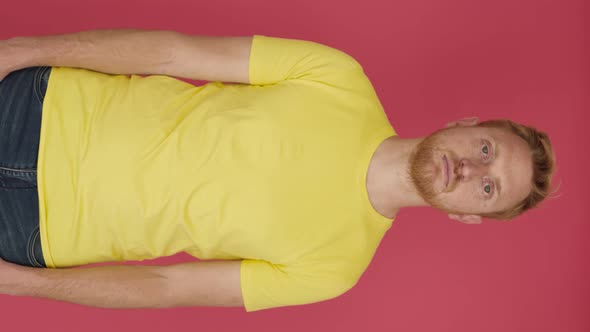 Redhead Young Man Crossing Arms and Smiling at Camera Over Isolated Background