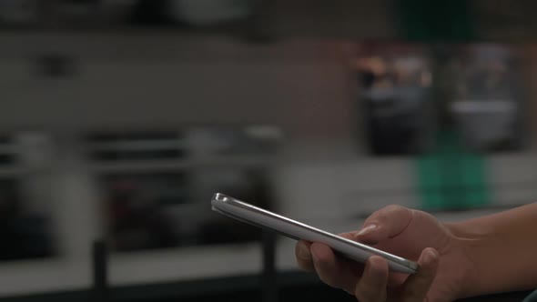 Woman with Mobile Phone in Subway