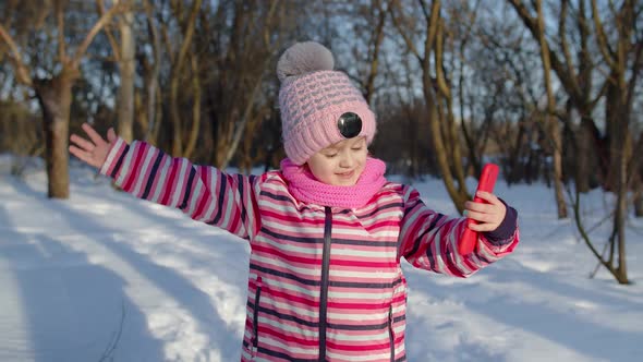 Children Kid Blogger Waving Hello Making Video Call Online Stream on Social Media in Winter Park