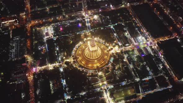 Aerial top view of Phra Pathommachedi temple at sunset in Nakorn Pathom district, Thailand.