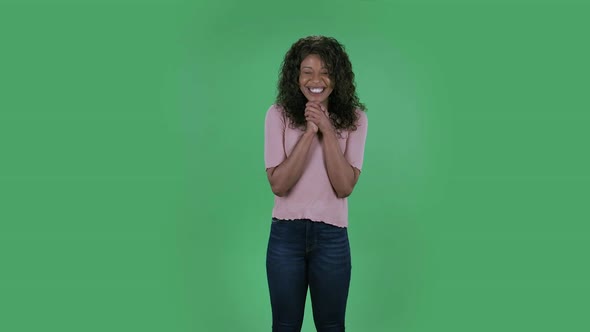 Portrait of Beautiful African American Young Woman Smiles with Happy Joy. Burning Brunette with Wavy