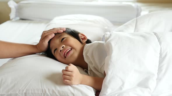 Cute Asian Child Sleeping On White Bed With Mother Care Slow Motion