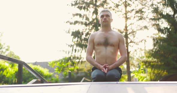 Man Practicing Yoga Outdoor in Morning