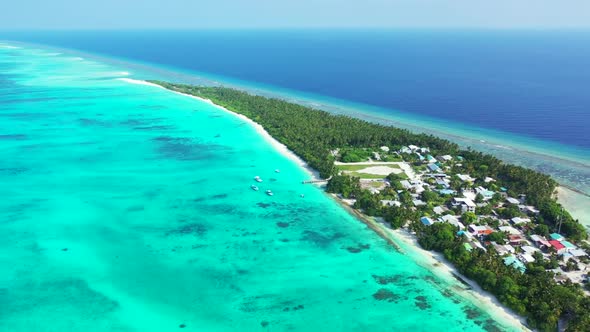 Aerial drone scenery of exotic shore beach vacation by blue lagoon and white sandy background of a d