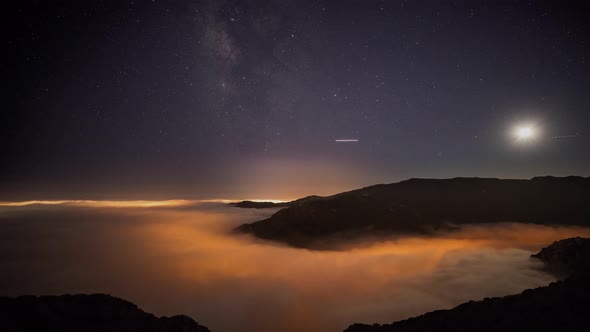 Night time lapse of a road winding through the mountains in Malibu California