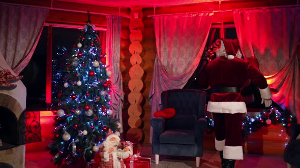 Santa Claus in beautiful room during Christmas night