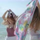 Two Asian girl friends are having fun on the beach while on vacation. concept of freedom, travel - VideoHive Item for Sale