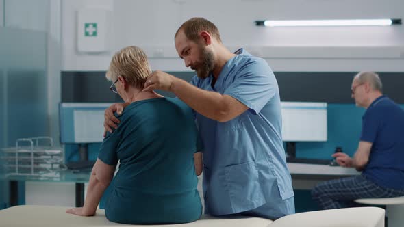 Health Specialist Doing Osteopathy Procedure on Old Patient