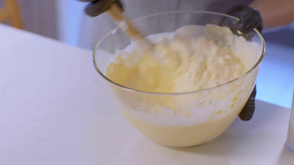 Pastry Chef Is Pouring Whipped Cream Into A Bowl