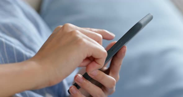 Woman use of mobile phone at home