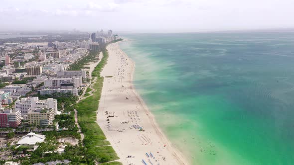 Panoramic View of the Beach Line Between the Ocean and the Coastal City. Aerial View