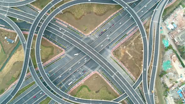Top View To the Cars Driving on Multi-level Highway on the Sunset. Highway Multilevel Junction Road