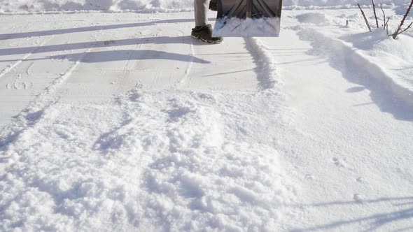 Throwing Snow with a Shovel