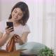 Happy Beautiful Asian Woman Opening Box With Ordered Clothes And Take A Picture. - VideoHive Item for Sale