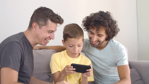 Boy Playing Online Game on Smartphone