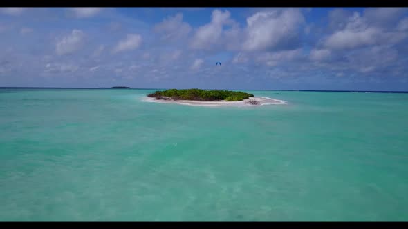 Aerial tourism of perfect bay beach wildlife by clear sea with white sandy background of a dayout ne