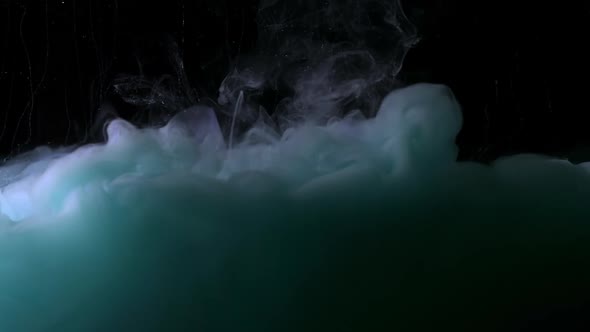 Teal Blue Fluid Pearl Cloud Is Moving Hypnotically on the Black Background