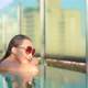 Young asian woman enjoy around outdoor swimming pool for leisure - VideoHive Item for Sale