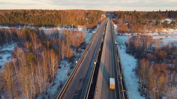 Tranquil Winter Landscape with a Motor Road at Sunset Aerial View