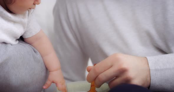 Charming Baby Girl is Fed with a Spoon of Healthy Vegetable Puree